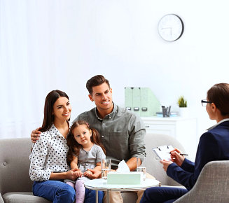 happy family talking to their doctor