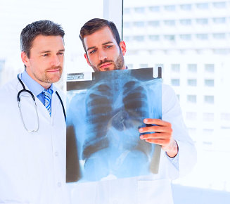 two doctors looking on the x-ray result